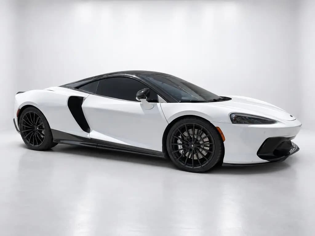 McLaren GT front three-quarter view, after CarShots White Studio background